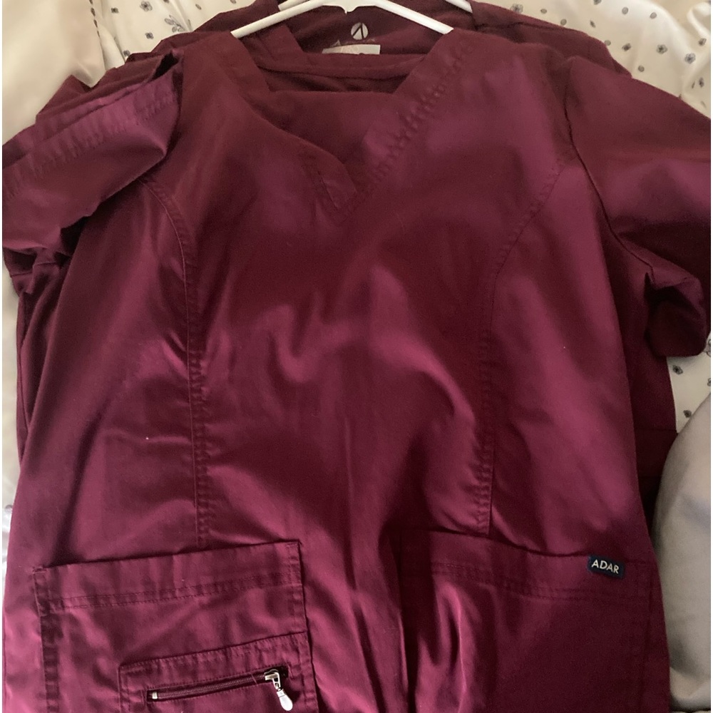 Here is 3 burgundy more scrub sets . Two are Adair and one is Barcode 1